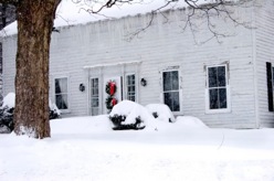 Old House with Christmas Wreath in Winter