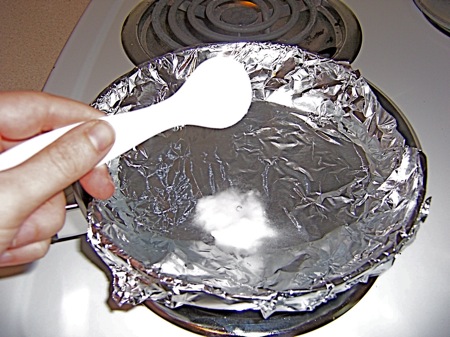 What is a simple way to clean tarnish off of silverware?